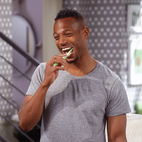  A GIF of a man diligently cleaning his teeth.