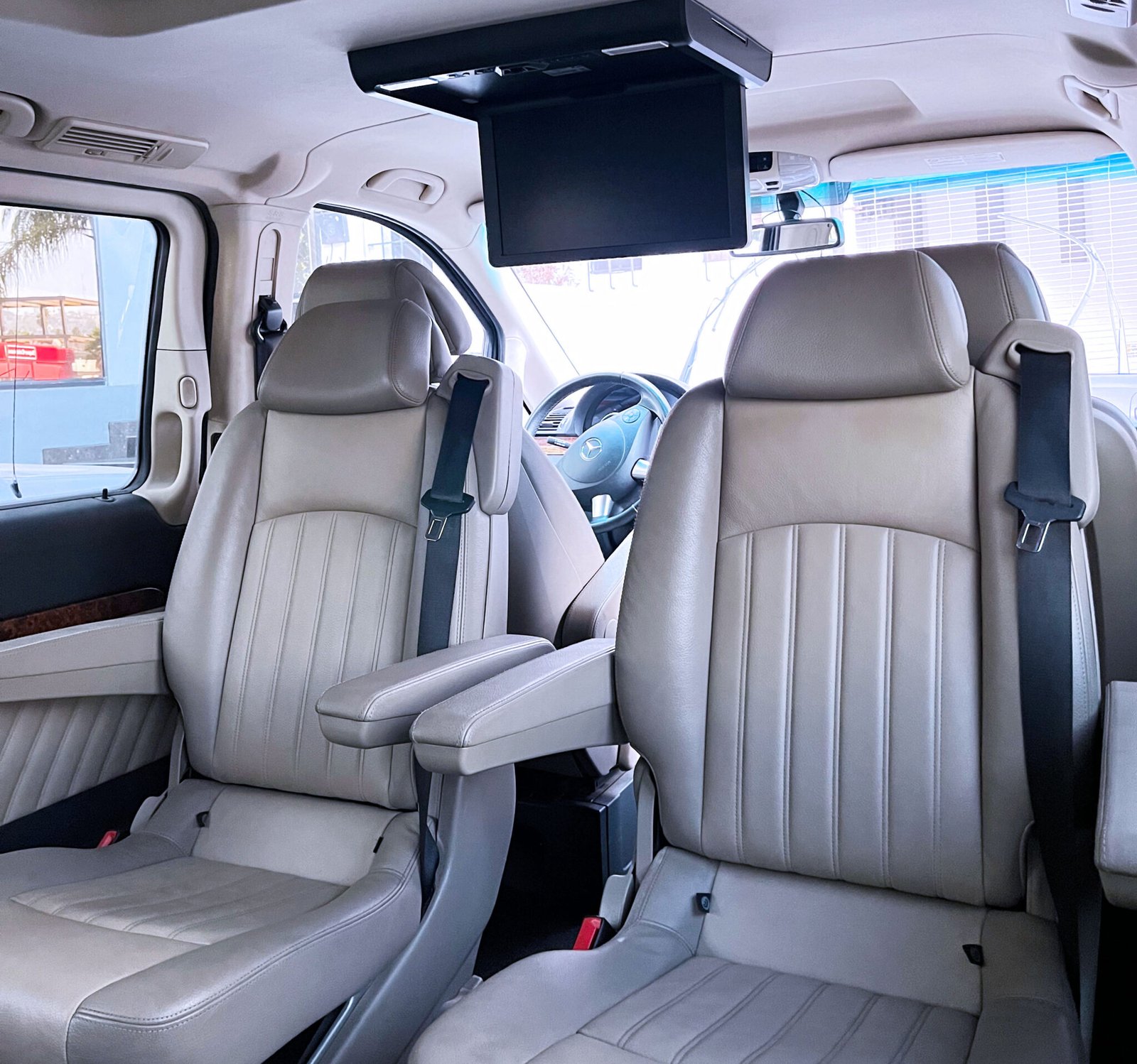 A glimpse inside a luxurious patient transport van, featuring seating for up to four passengers in opulent comfort.