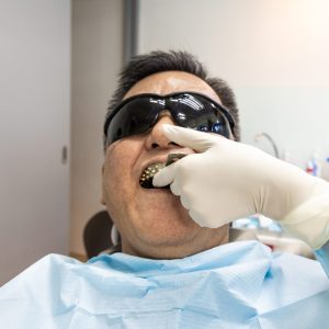 old man getting impression for dentures in tijuana